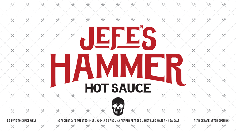 Sauce bottle white label with bespoke hammer pattern in background and large red logo text in center